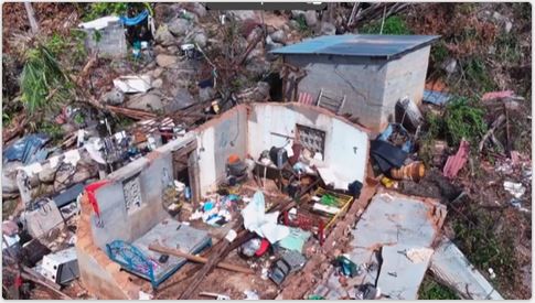 Aerial view of roofless homes wind damage