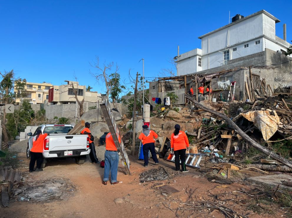 Volunteers repairing storm damaged house in Acapulco, Mexico.